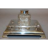 A GEORGE V SQUARE INKSTAND with cut glass bottle. Sheffield 1919 Maker: James Dixon & Son.