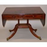 A 19TH CENTURY MAHOGANY SOFA TABLE, the rectangular top with cut corners to the flaps, two frieze