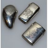 A VICTORIAN SILVER TEARDROP VESTA, Birmingham 1888, and  TWO OTHER VESTAS engraved with initials,