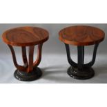 A PAIR OF ART DECO DESIGN CIRCULAR COFFEE TABLES on four curving supports and circular bases.