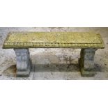 A RECONSTITUTED STONE GARDEN BENCH 3ft 9ins long.