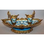 A 19TH CENTURY FRENCH SEVRES PORCELAIN AND ORMOLU MOUNTED DESK STAND with two inkwells, the body