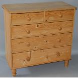 A VICTORIAN PINE STRAIGHT FRONT CHEST of TWO SHORT AND THREE LONG GRADUATED DRAWERS with wooden