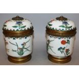 A GOOD PAIR OF 19TH CENTURY SAMSON PORCELAIN CIRCULAR BOWLS AND COVERS with metal mounts, the bodies