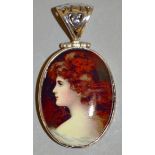 A SILVER MOUNTED PORTRAIT PENDANT.