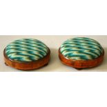 A PAIR OF VICTORIAN MAHOGANY INLAID FOOTSTOOLS with padded needlework tops.