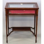 AN EDWARDIAN MAHOGANY INLAID RECTANGULAR TOP BIJOUTERIE TABLE with rising top, velvet interior on