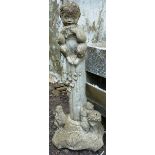 A RECONSTITUTED STONE GARDEN ORNAMENT modelled as Pan 2ft 10ins high.