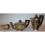 A TEN SIDED MATCHING TEAPOT, HOT WATER JUG AND MILK JUG with ebony handle and finial. Sheffield 1938