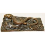 A PATINATED SPELTER MODEL OF A SALAMANDER LIZARD on a rectangular base. 7.25ins x 4ins.