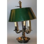 A STUDENT’S 19TH CENTURY PLATED THREE LIGHT LAMP on a circular base 23ins high.
