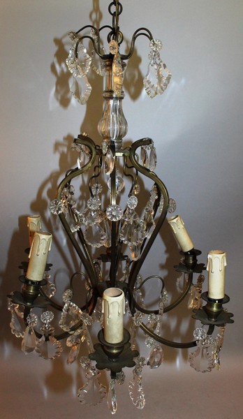 A 19TH CENTURY FRENCH GILT METAL AND GLASS CHANDELIER with cut glass drops and six candle holders.