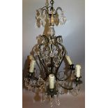 A 19TH CENTURY FRENCH GILT METAL AND GLASS CHANDELIER with cut glass drops and six candle holders.