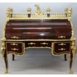 A SUPERB LARGE LOUIS XVI STYLE MAHOGANY CYLINDER BUREAU, the top with pierced gilded rail with