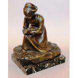 JEAN CHATEIGON (CIRCA. 1910) FRENCH A BRONZE OF A SEATED DUTCH GIRL. Signed, on a marble base 6ins