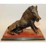 AFTER THE ANTIQUE A GOOD BRONZE OF A SEATED WARTHOG on a marble base. 9ins long overall, 7ins high.