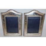 A PAIR OF PHOTOGRAPH FRAMES with serpentine tops. 8ins x 5.5ins London.