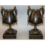 A GOOD PAIR OF 19TH CENTURY “EGYPTIAN DESIGN” TWO HANDLED URNS on marble stands with Egyptian figure