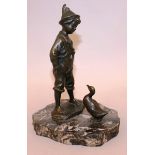 SATENELL (CIRCA. 1900) DUTCH AN AMUSING BRONZE GROUP OF A BOY LOOKING AT A DUCK on a shaped marble