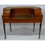 A 20TH CENTURY MAHOGANY “CARLTONHOUSE” DESK of typical form with line inlaid decoration, brass