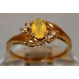 A SMALL DRESS RING set in 9ct gold.