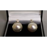 A LARGE PAIR OF PEARL AND DIAMOND EARRINGS set in yellow gold.