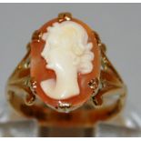 A GOOD OVAL CAMEO RING of a young lady, set in 9ct gold.