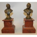 A GOOD PAIR OF 19TH CENTURY BRONZE BUSTS OF VOLTAIRE AND A LADY. 5.5ins high, standing on marble