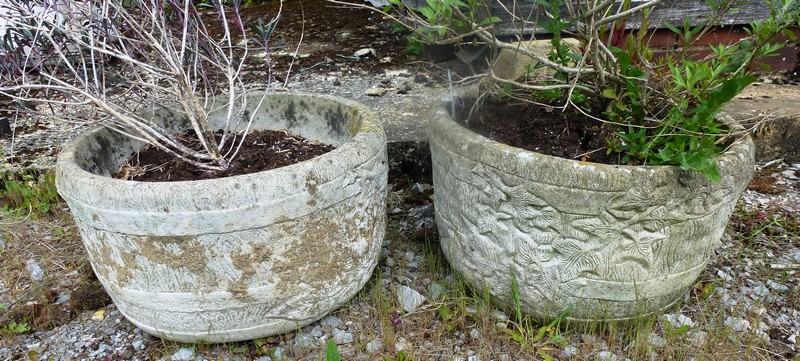 A PAIR OF RECONSTITUTED STONE GARDEN PLANTERS of moulded circular form 10ins high.