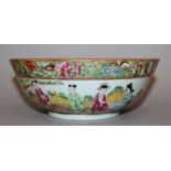 A 19TH CENTURY CHINESE CANTON PORCELAIN BOWL, the interior painted with figural panels within key-