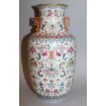 A FINE QUALITY CHINESE FAMILLE ROSE PORCELAIN VASE, the sides and waisted neck well painted with a