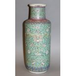 AN EARLY 20TH CENTURY CHINESE TURQUOISE GROUND FAMILLE ROSE PORCELAIN VASE, painted with a formal