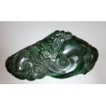 A 19TH/20TH CENTURY CHINESE SPINACH GREEN JADE TABLET, possibly a scroll weight, the flattened