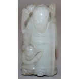 A 19TH CENTURY CHINESE PALE CELADON JADE CARVING OF SHOU LAO, the deity holding a staff, with a