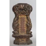 A CHINESE GILDED & LACQUERED CARVED WOOD SHRINE, with a pierced dragon surround enclosing a panel of