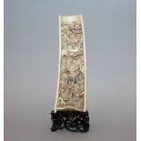 A GOOD 19TH CENTURY CHINESE IVORY WRIST REST, together with a carved and pierced fitted hardwood