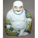 AN EARLY 20TH CENTURY CHINESE REPUBLIC PERIOD FAMILLE ROSE PORCELAIN FIGURE OF BUDAI, seated with