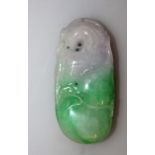 A CHINESE FU SHOU LU JADEITE PENDANT, carved and pierced in the form of a phoenix perched on a