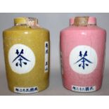 TWO SIMILAR CHINESE TEA JARS, with incorporated covers, one pink ground, the other olive-green