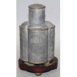 AN EARLY 20TH CENTURY CHINESE PEWTER TEA CADDY & CYLINDRICAL COVER, together with a fixed wood