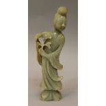 A GOOD QUALITY 19TH CENTURY CHINESE CARVED CELADON JADE FIGURE OF A LADY, dressed in flowing robes
