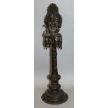 A LARGE 19TH CENTURY INDIAN GANESH ALTER COLUMN, surmounted by the elephant-head deity on a lotus