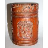 A 19TH/20TH CENTURY CHINESE BAMBOO JAR & COVER, the sides carved with relief panels of sages and