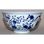 A 19TH CENTURY CHINESE BLUE & WHITE PORCELAIN BOWL, the sides painted with peach, pomegranate, peony