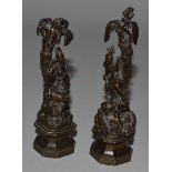 A GOOD PAIR OF SMALL BRONZES OF INDIANS standing beneath palm trees on octagonal bases 4.5ins high.