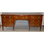 A GEORGE III MAHOGANY AND SATINWOOD CROSSBANDED PEDESTAL SIDEBOARD, with a bow front central drawer,