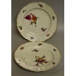 A PAIR OF 18TH CENTURY LUDWIGSBURG PLATES with basket weave border painted with flowers.