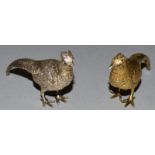 A SILVER AND SILVER GILT CAST MODEL OF A PHEASANT. 2.75ins long.