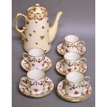 AN EARLY 20TH CENTURY GEORGE JONES CRESCENT WARE THIRTEEN PIECE COFFEE SERVICE, five coffee cans,