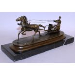 V. GIZACHER A BRONZE RUSSIAN HORSE AND SLEDGE. Signed 8.5ins long, on a marble base.